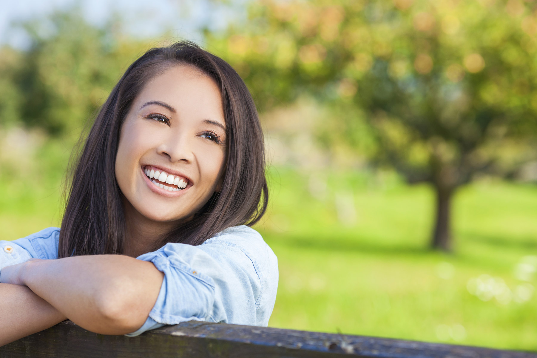 Smiling Woman at Fence